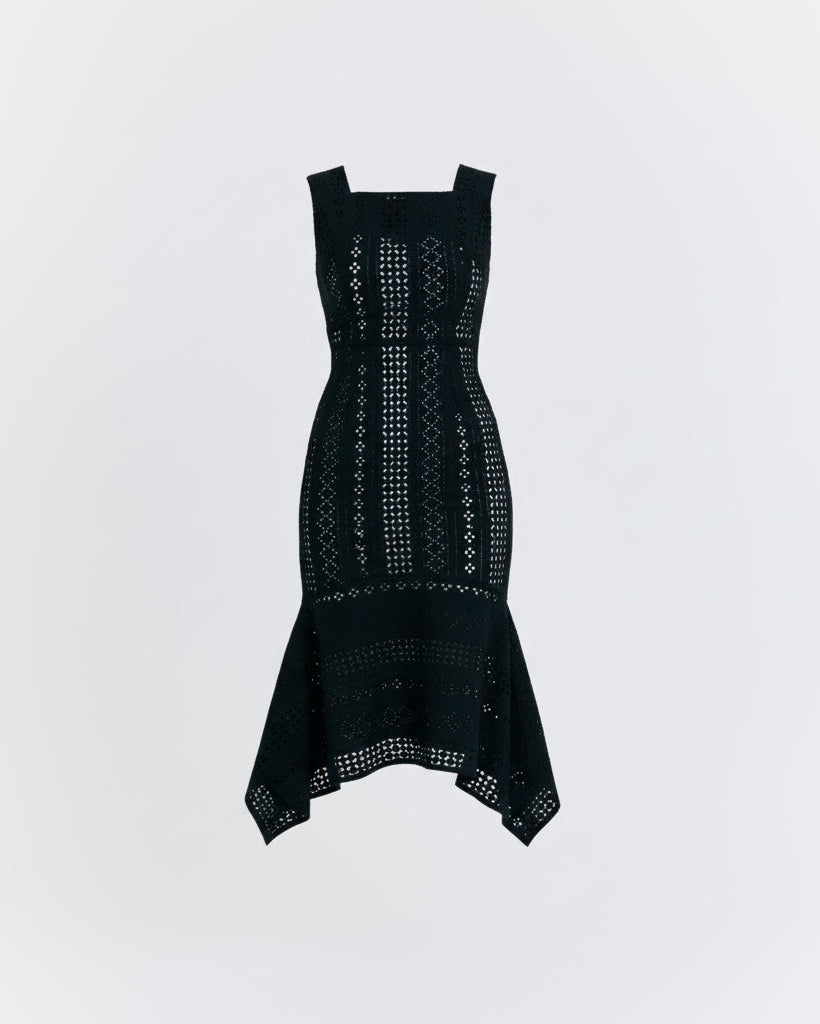 Black dress with intricate patterns on a light gray background