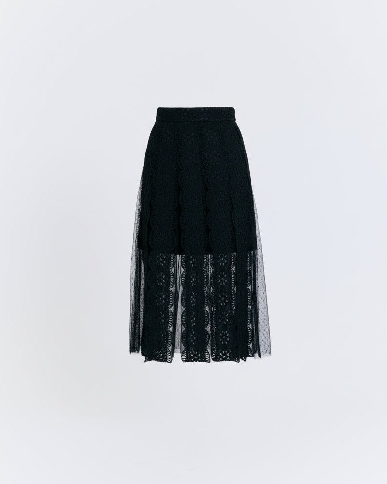 Black skirt with lace detailing on a white background