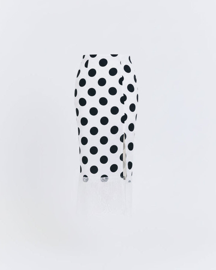 Black and white polka dot skirt on a light gray background