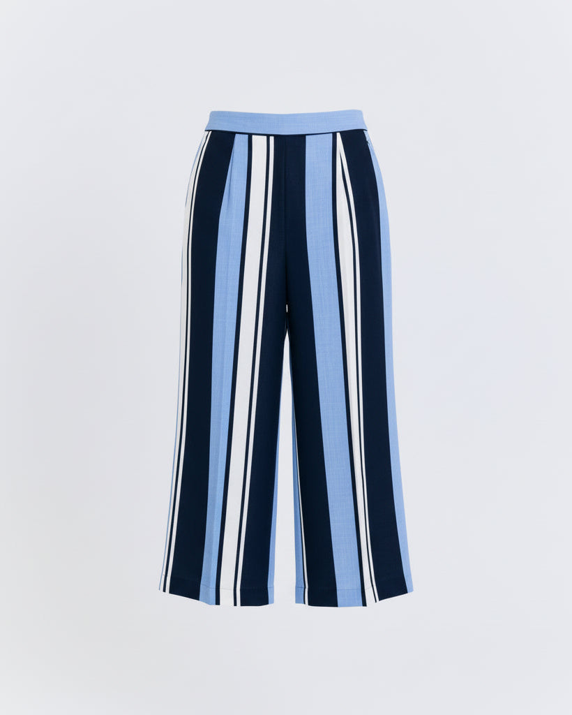 Striped pants with blue, white, and navy pattern on a light gray background