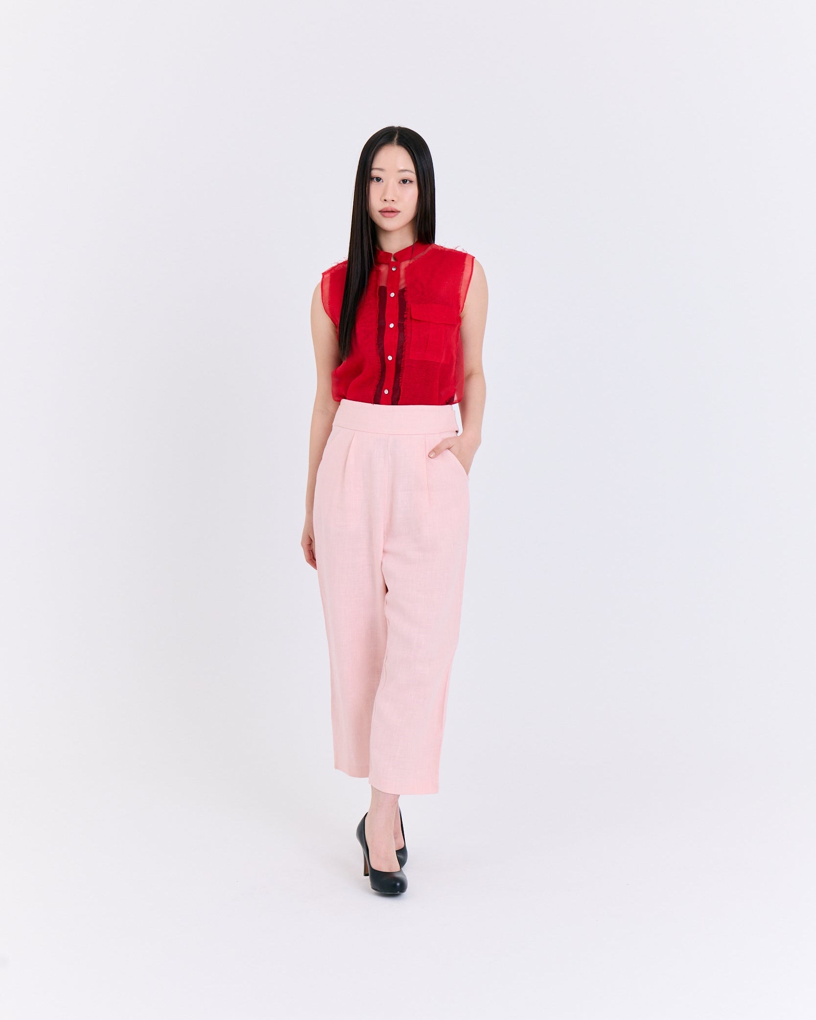 A red sleeveless top with a pocket