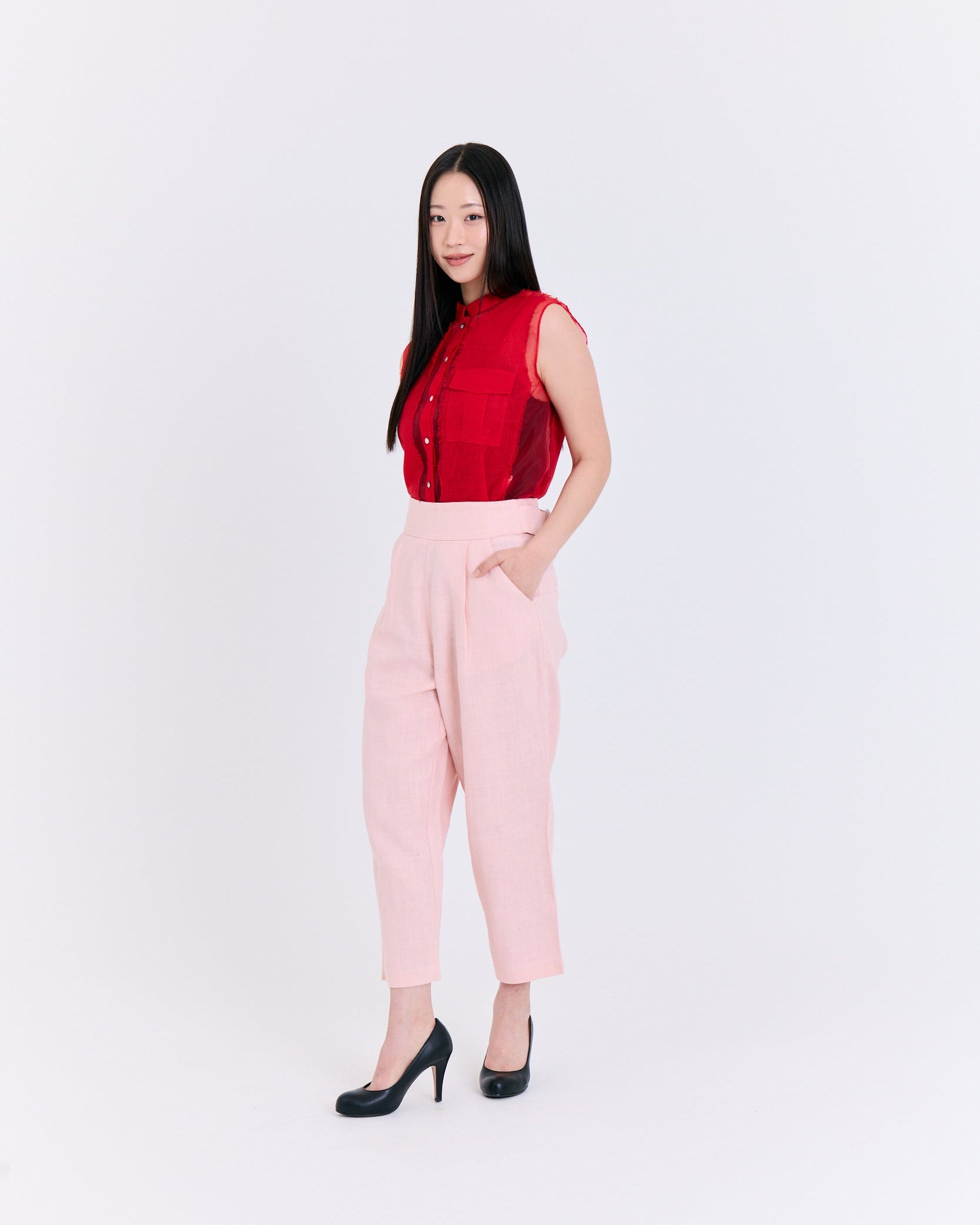 A red sleeveless top with a pocket