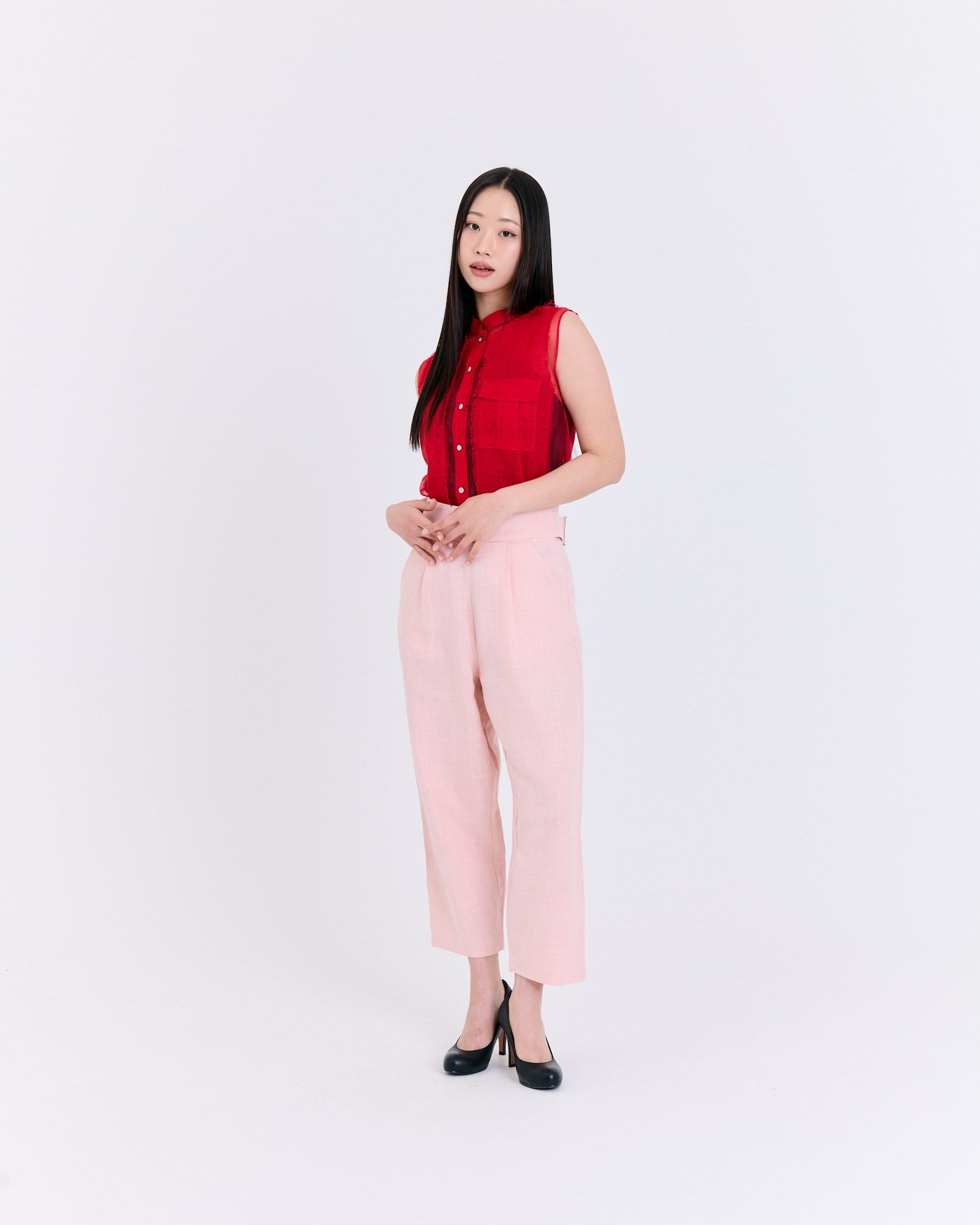 A red sleeveless top with a pocket