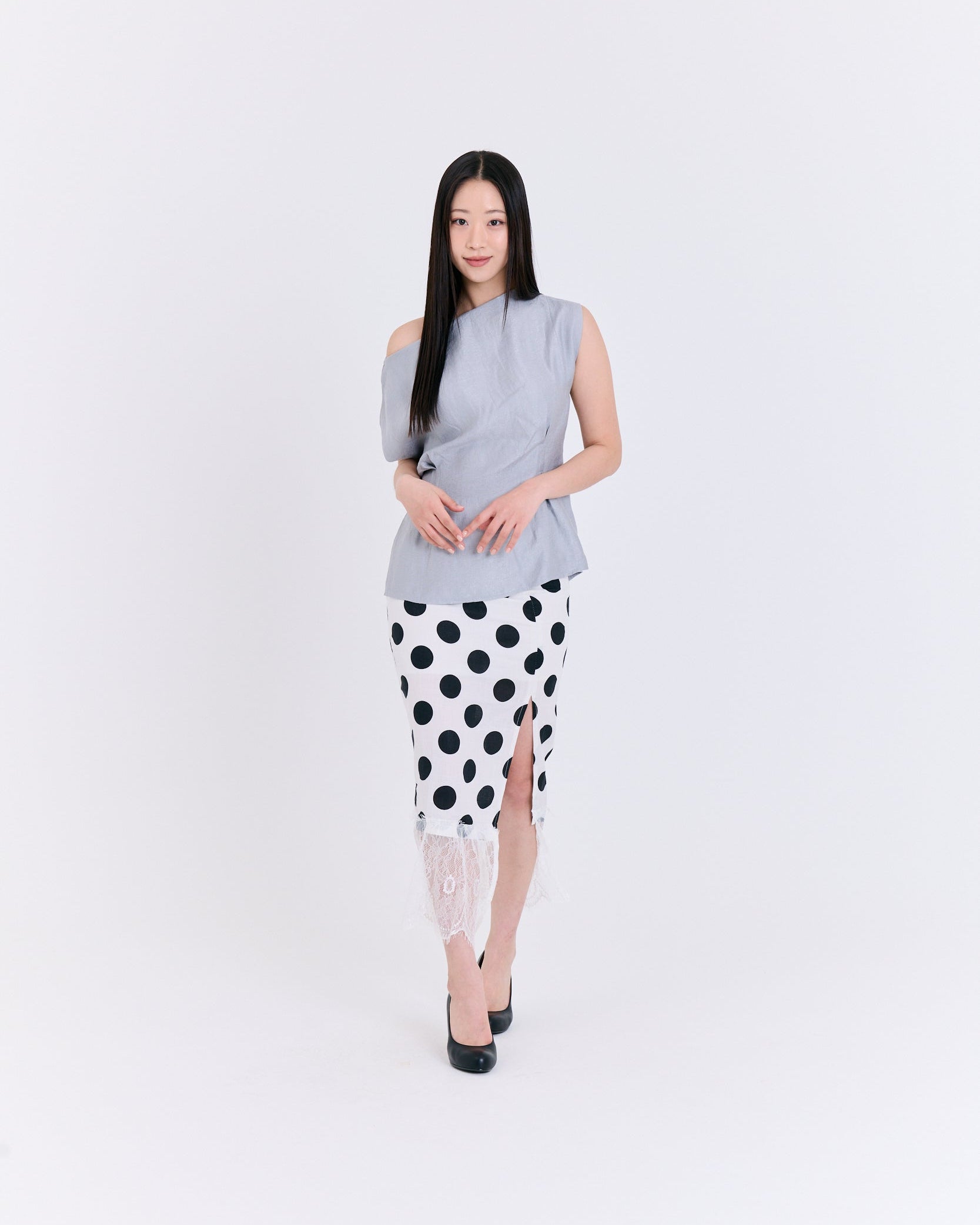 A light Grey fabric top with folds