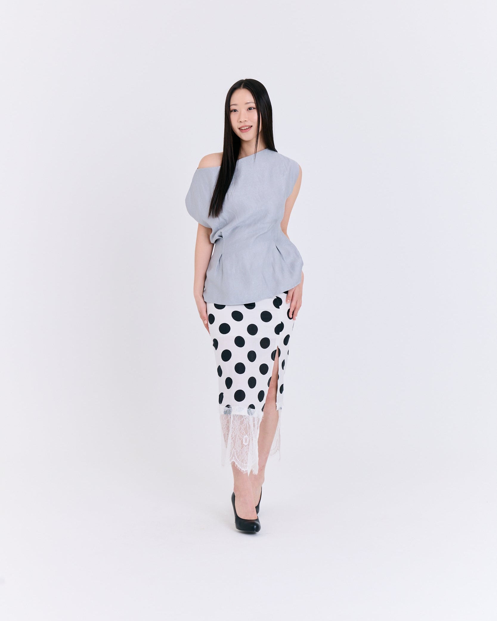A light Grey fabric top with folds