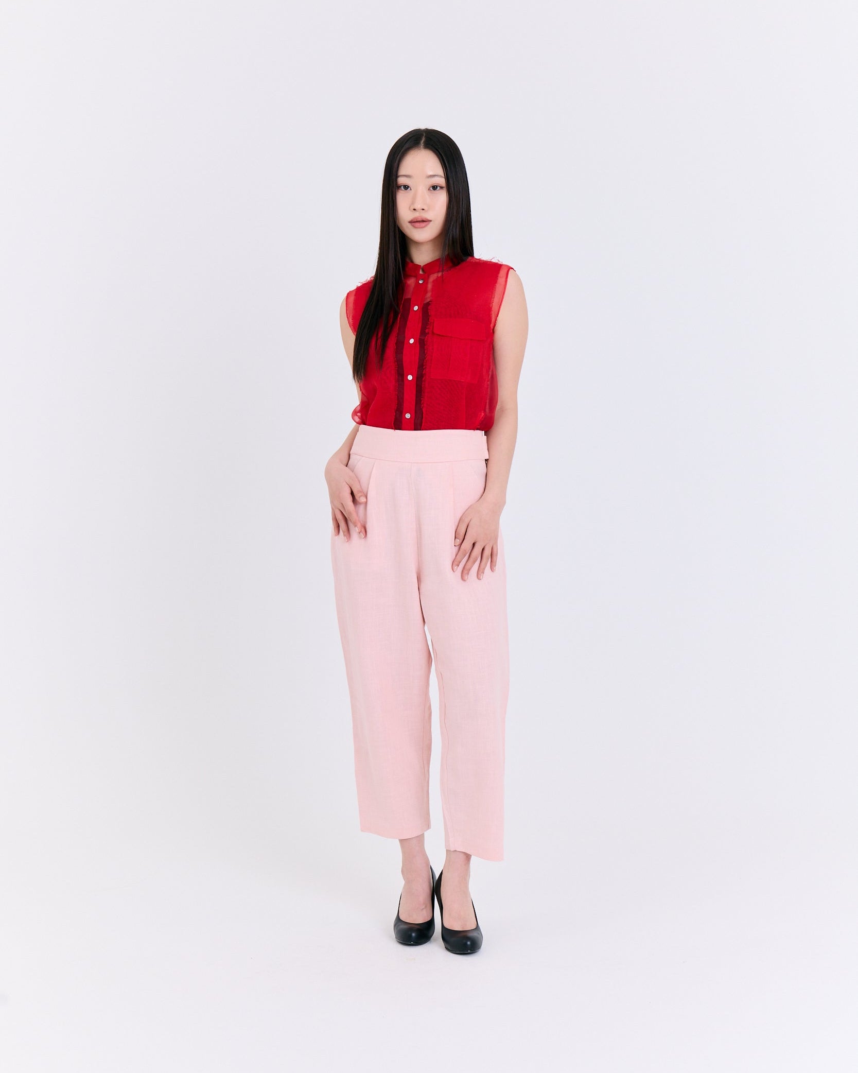 A red sleeveless top with a pocket