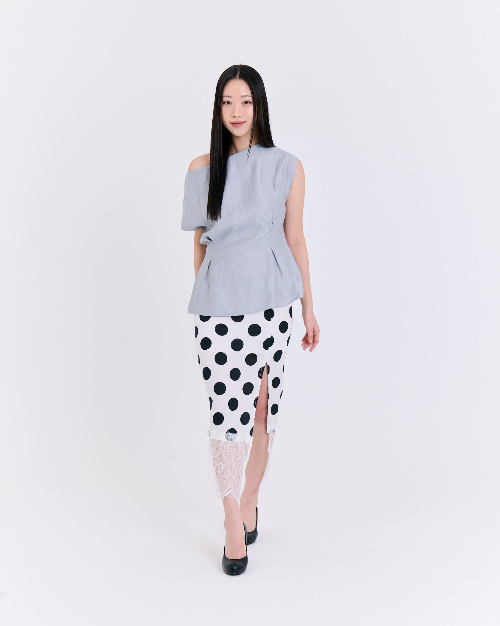 A light blue fabric top with folds